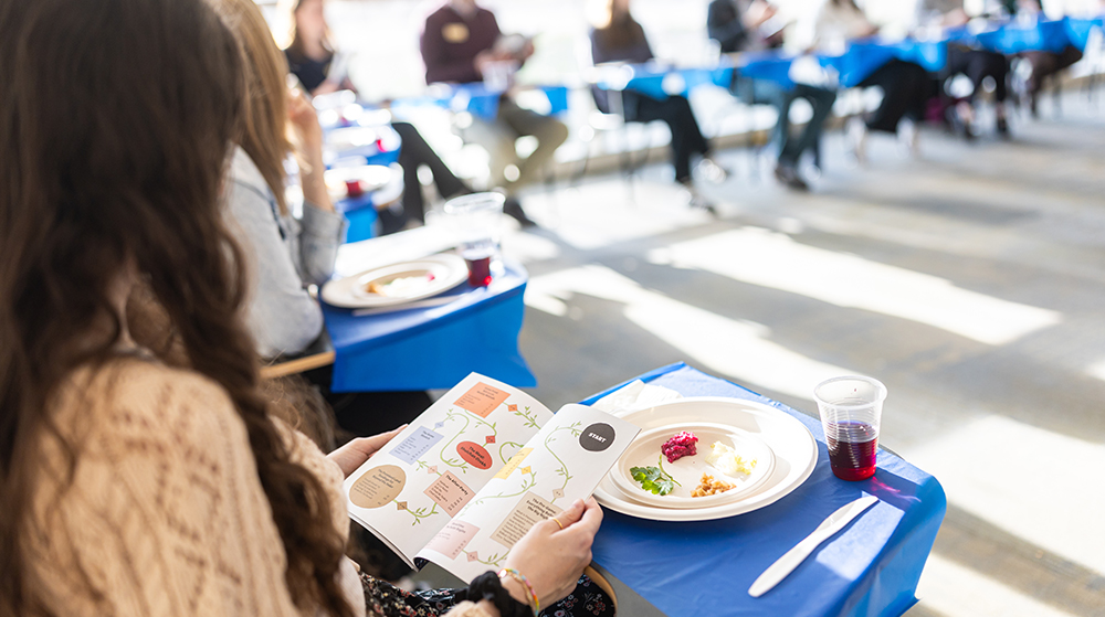 A student holding a Passover book